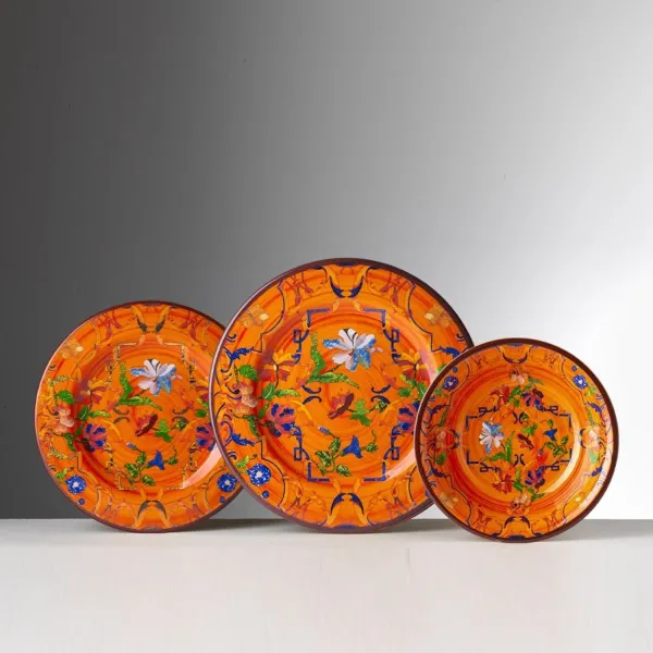 Set of 6 patterned 19cm deep melamine plates in orange by Pancale, available at Mario Luca Giusti