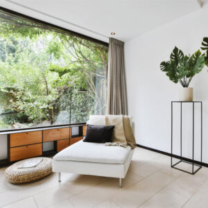 Picture with chaise longue and a window